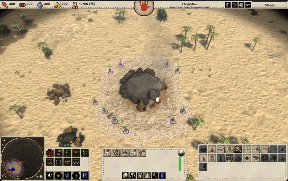 A desert start: the big cave, a ring of workers, and the cave-painting HUD with the minimap and command buttons.